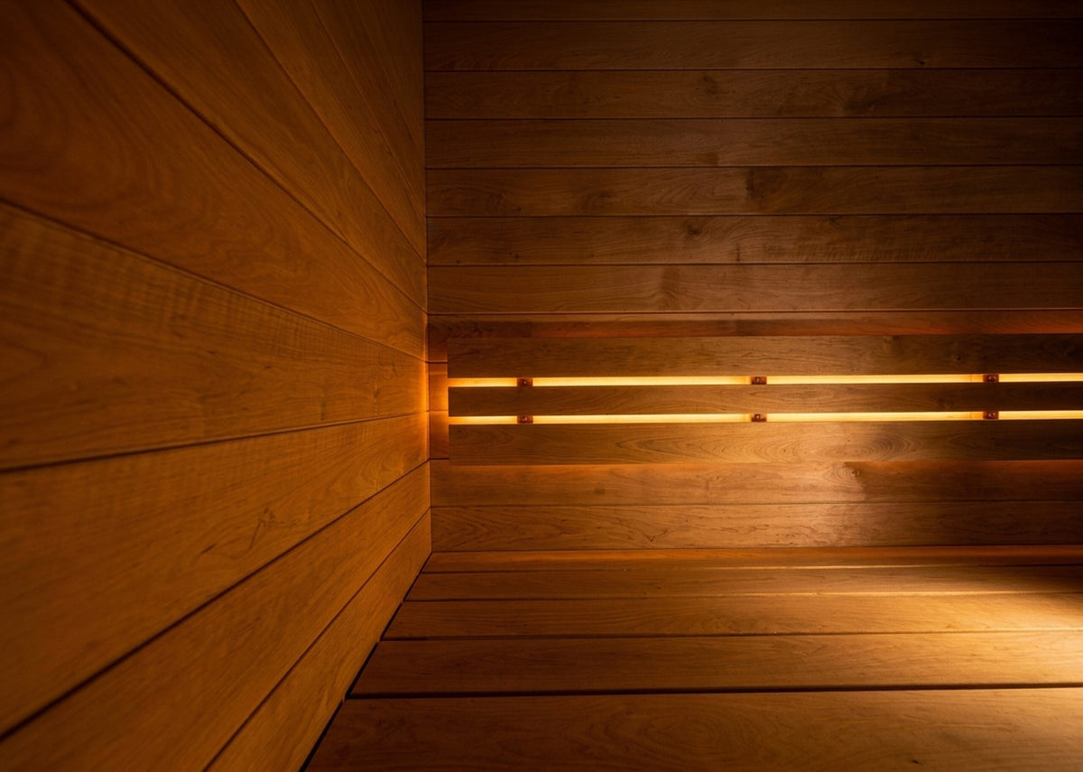 Detail of warm wood grain and softly lit bench slats inside a SaunaLife G6 sauna.